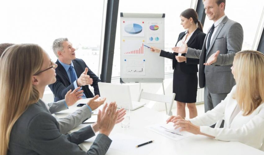 Business,People,Team,At,Presentation,Working,With,Charts,And,Diargams
